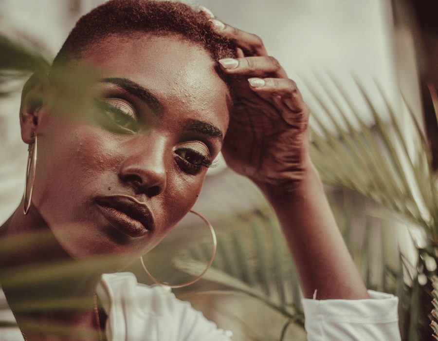 a woman with short hair and big earrings