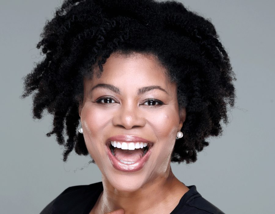 a woman with curly hair and a black shirt