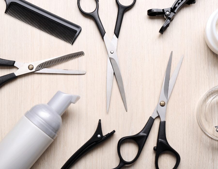 a hairdresser's tools and a bottle of hair spray